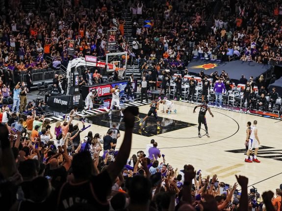 NBA basketball game with excited crowd